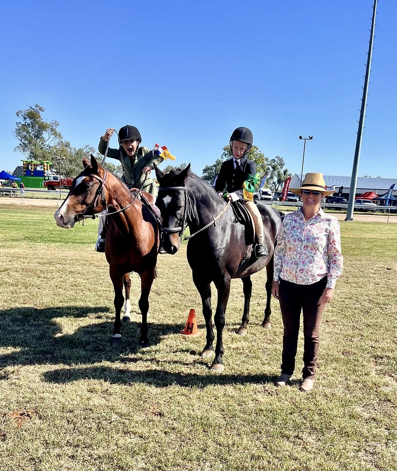 Marcus o’Neill and Tommy Fanning celebrate winning champion and reserve champion in the junior boy rider, with Judge Kirrily Dear.