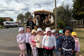 The children at Nyngan Preschool had a great time meeting Harry Vidal, the Clydesdales Henry and George and Wa the dog.