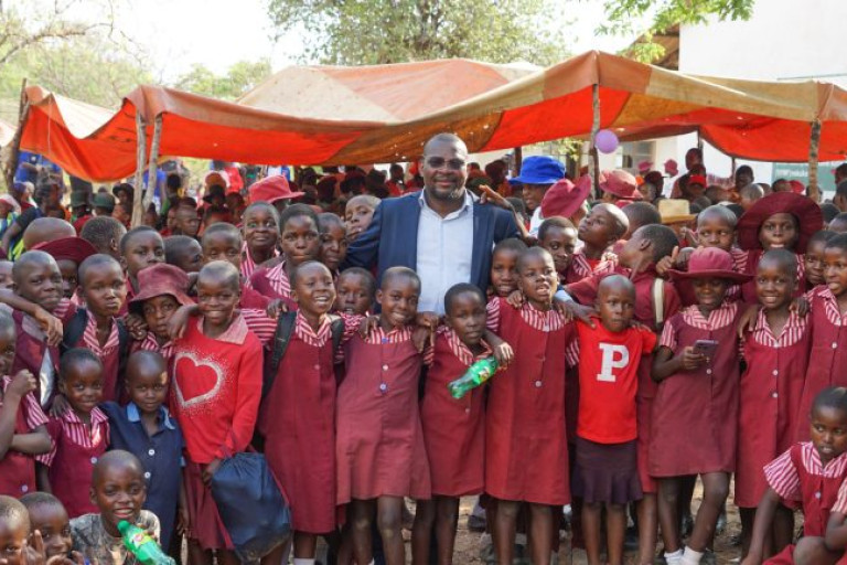 Local pharmacist Emmanuel Pasura recently travelled to his native country of Zimbabwe to open a classroom block he funded in memory of his late mother. Photo contributed.