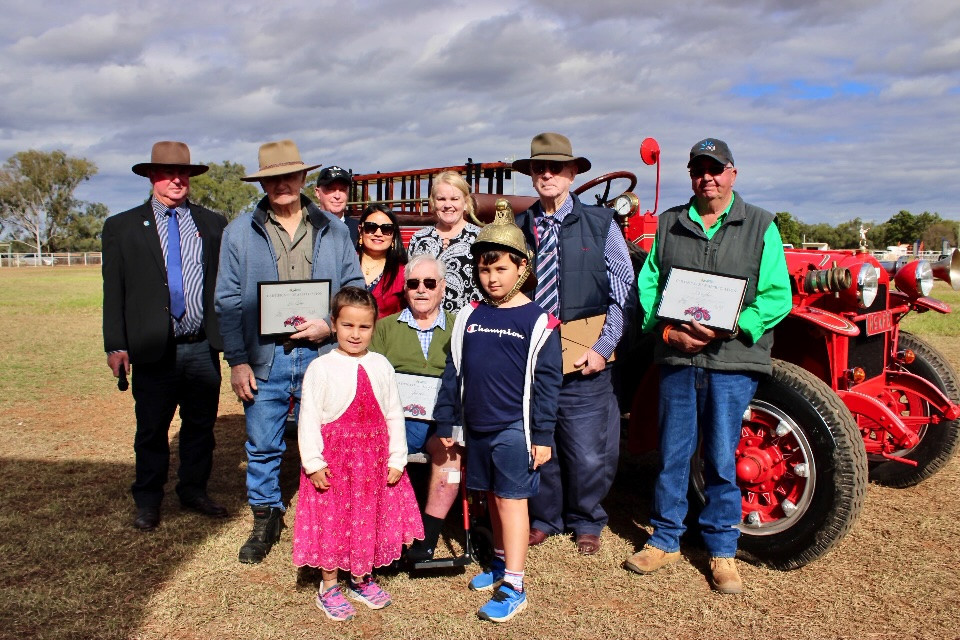 Keith White (centre) with Bogan Shire Council mayor Glen Neill, Brian Hodge, David, Alice, Salina, Jane, and Stanley White, Toby Neill, and Rob Avard with the recently restored Garford Fire Engine. Photos by The Nyngan Weekly: Abigail McLaughlin.