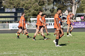 The first grade side take to the field.